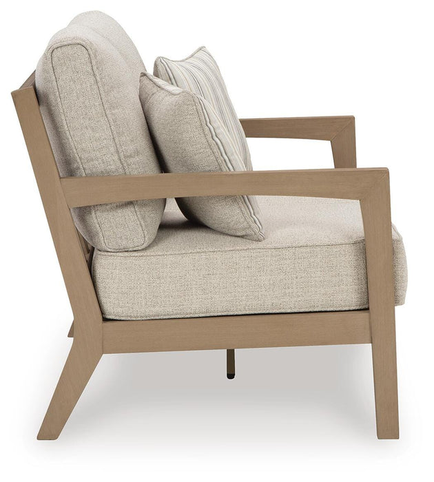 Hallow Creek Outdoor Loveseat with Cushion - Bill's Discount Center (Bradenton, FL)