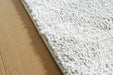 Unawick Large Rug - Bill's Discount Center (Bradenton, FL)